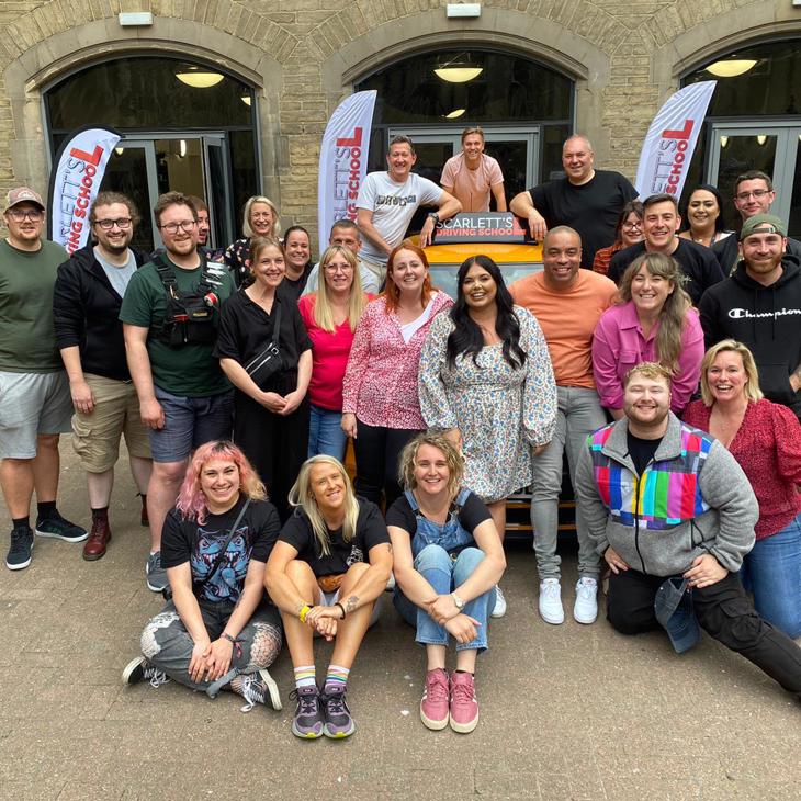 The cast and crew of Scarlett's Driving School