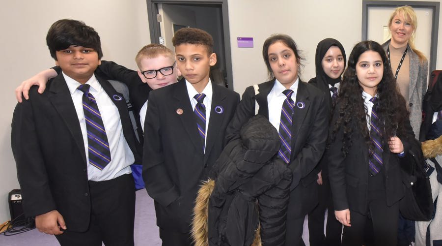 An image of a group of school children stood together